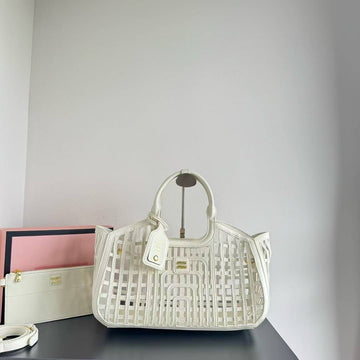 MIU MIU LEATHER TRIMMED LARGE BUCKET BAG WITH UTILITY POUCH