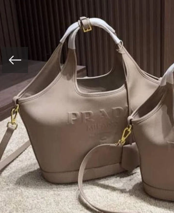 PRADA EMBOSSED LOGO BUCKET BAG