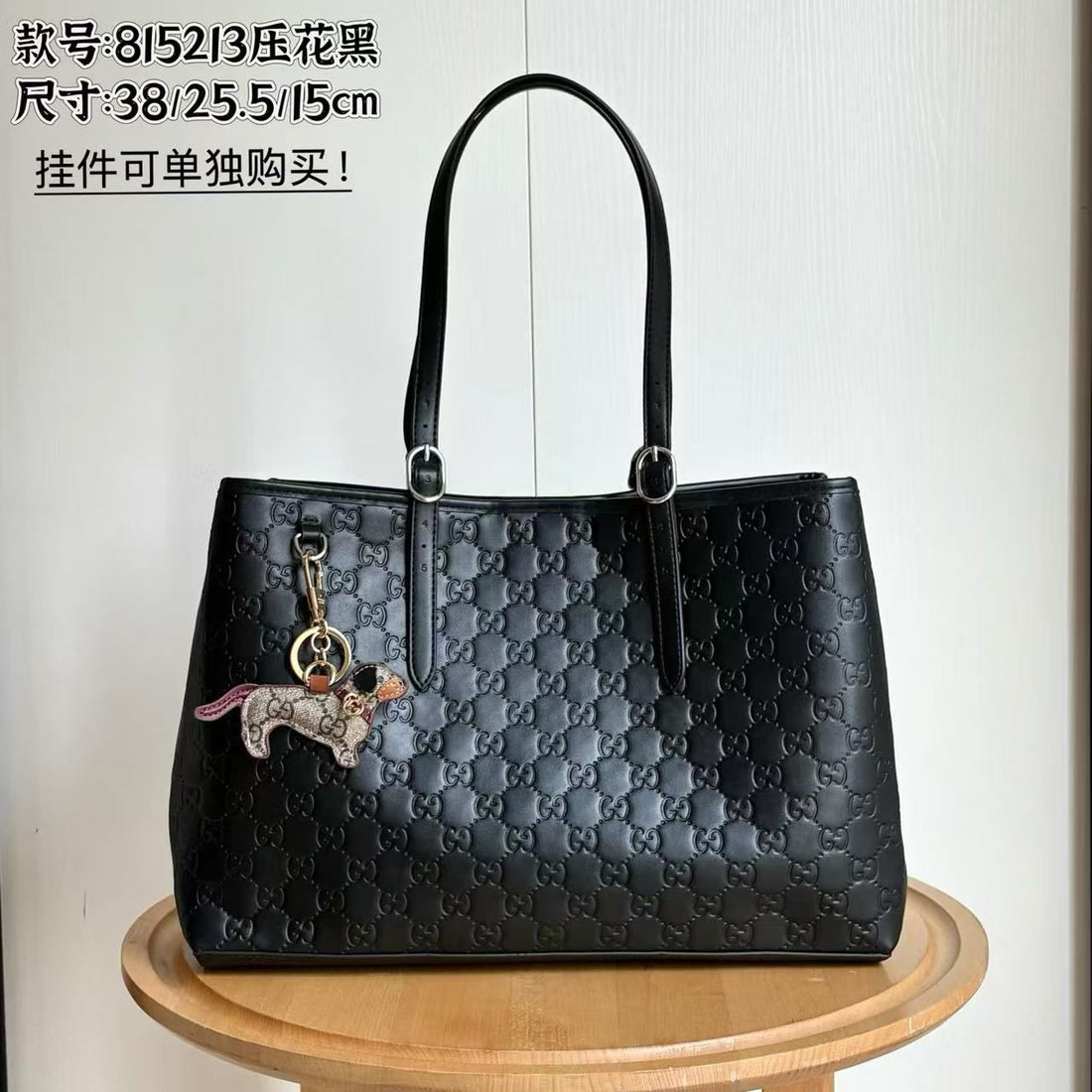 GUCCI EMBLEM BLACK EMBOSSED TOTE WITH CHARM