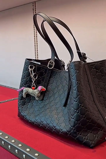 GUCCI EMBLEM BLACK EMBOSSED TOTE WITH CHARM